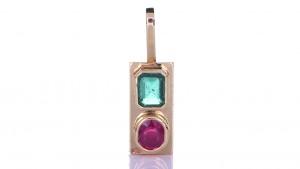 Green Sapphire And A Ruby Placed On A Gold Pendant