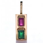 Green Sapphire And A Ruby Placed On A Gold Pendant