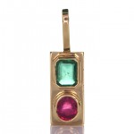 Two Green Sapphire And A Ruby Placed On A Gold Pendant