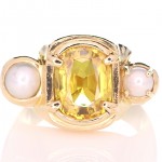 Yellow Sapphire With 2 White Pearls On A Golden Ring