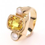 Yellow Sapphire With 2 White Pearls On A Golden Ring