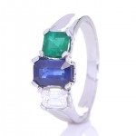 Blue Sapphire, Green Emerald And A Diamond Placed On A Silver Ring