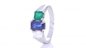 Blue Sapphire, Green Emerald And A Diamond Placed On A Silver Ring