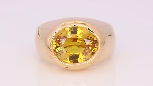 Golden Emerald Placed In A Golden Ring