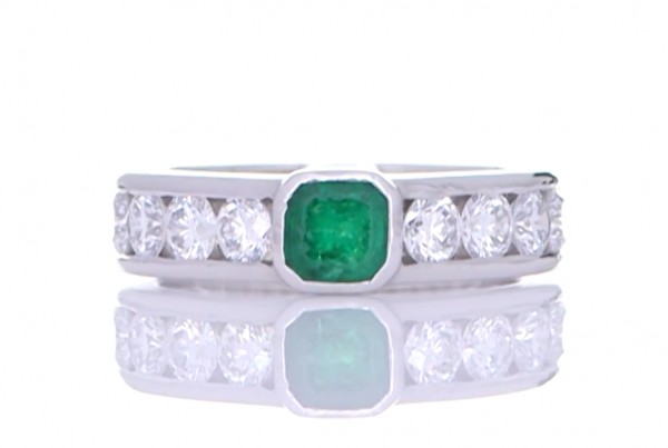 Green Emerald Ring Surrounded By White Diamonds