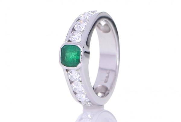 Green Emerald Ring Surrounded By White Diamonds