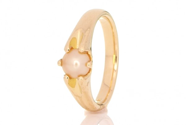 White Pearl Placed In A Golden Ring
