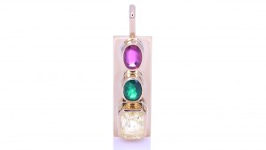 Golden Sapphire, Green Emerald And A Ruby On A Golden Pendant