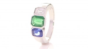 Green Emerald, Blue Sapphire And A Diamond On A Silver Ring