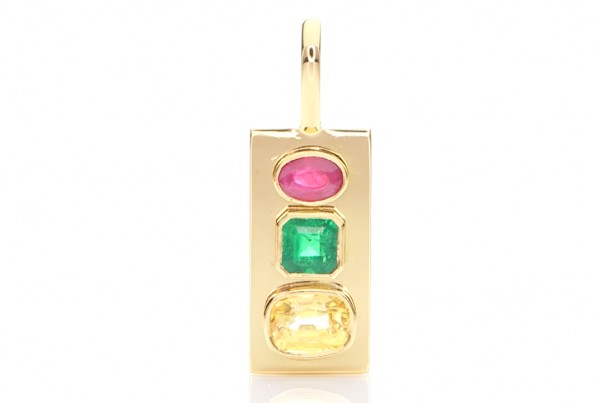 Green Emerald, Ruby And A Golden Sapphire Placed In A Golden Pendant