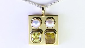 Two White Pearls With A Yellow And Golden Sapphires On A Golden Pendant 