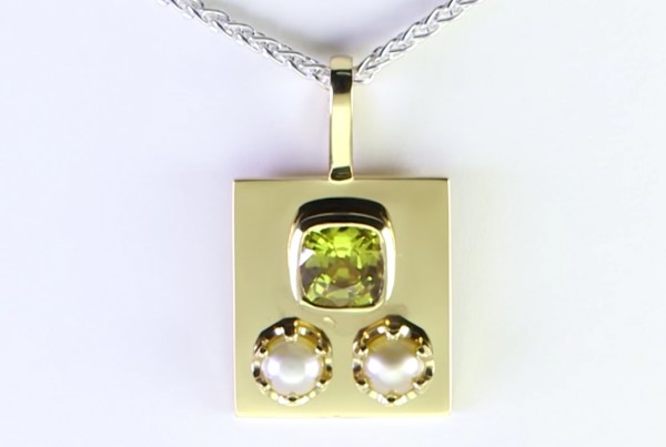 Two White Pearls With A Yellow Sapphire On A Golden Pendant 