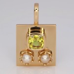 Two White Pearls With A Yellow Sapphire On A Golden Pendant 