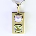 White Pearl With A Yellow Sapphire On A Golden Pendant