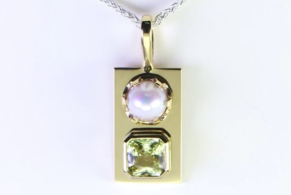 White Pearl With A Yellow Sapphire On A Golden Pendant