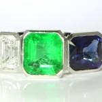 Green Emerald, Blue Sapphire & A Diamond Mounted in A Platinum Ring