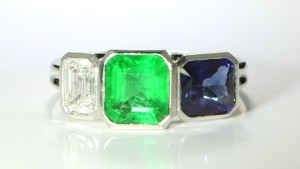 Green Emerald, Blue Sapphire & A Diamond Mounted in A Platinum Ring