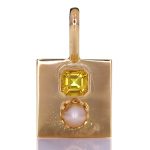 Golden Pendant With Yellow Sapphire And A White Pearl