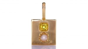 Golden Pendant With Yellow Sapphire And A White Pearl
