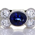 Platinum Ring With Four Diamonds And Blue Sapphire