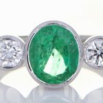 Platinum Ring With Two Diamonds And Green Sapphire