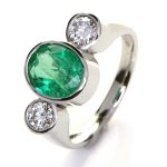 Platinum Ring With Two Diamonds And Green Sapphire