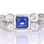 Four Diamonds With A Blue Sapphire Mounted On A Platinum Ring