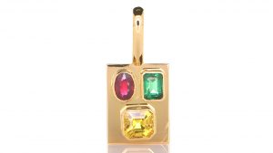 Golden Pendant With Green Emerald, A Ruby. And A Yellow Sapphire