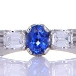 Platinum Ring With A Blue Sapphire With Two Diamonds