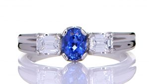 Platinum Ring With A Blue Sapphire With Two Diamonds